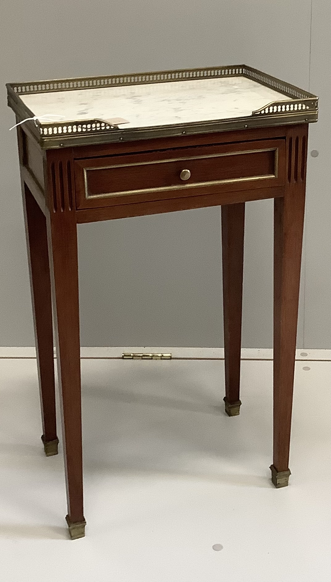 A French gilt metal mounted marble topped mahogany bedside table, width 42cm, depth 29cm, height 68cm